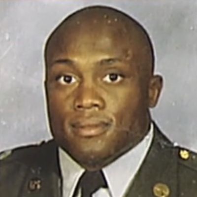 He is wearing a military uniform in the picture.